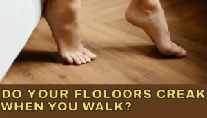 A pair of bare feet walking on a light-colored wood floor. The image includes a text overlay at the bottom that reads, "DO WOODEN FLOORS CREAK MORE IN WINTER?" in yellow capital letters against a brown background.